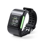 A black smart watch with a digital display, rubber strap, and a glowing green section on the side.