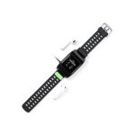 A black Pinsir Smart Watch with a green accent and two white wireless earbuds beside it.