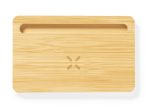 A bamboo charging organiser with a groove and a logo, designed for wireless charging devices.