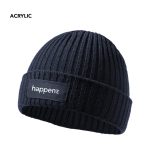 A navy beanie with a ribbed texture and a logo patch on the front. Made from acrylic material.
