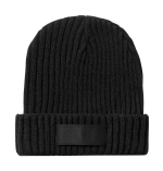 A black ribbed beanie with a fold-over cuff and a branding label.