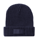 A navy blue ribbed beanie with a wide cuff and a branding label.