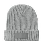 A grey beanie with a ribbed texture and a small patch for branding.