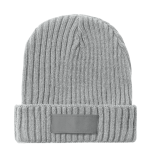 A grey ribbed beanie hat featuring a folded cuff and a blank branding area.