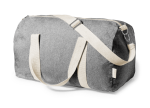 A grey duffel bag with cream straps, featuring a zip closure and branding on the side.