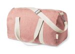 A pink duffel bag with a cream strap and handles, featuring a logo. The bag has a zippered closure.
