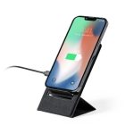 A wireless charger in black, featuring a phone mounted upright and connected with a charging cable.