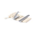 A nail clipper and nail file in a beige pouch. The clipper is silver, and the file has a grey finish.