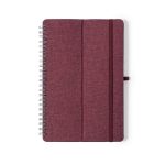 A maroon spiral-bound notebook with a textured cover and an elastic band. It features a branding logo.
