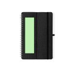 A black spiral-bound notebook with a textured cover, featuring a blank green area and an elastic band.