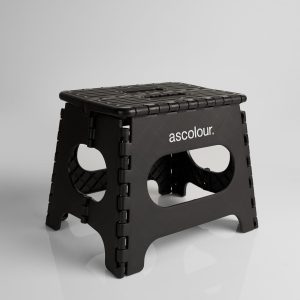 A black ASC Utility Stool with a textured surface and cut-out handles, featuring a logo on one side.