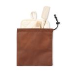 A brown pouch containing a beige spatula, a basting brush, and a pot holder. The pouch has a drawstring closure and a logo.