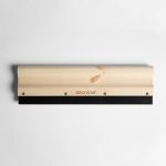 A wooden squeegee with a natural finish and a black rubber blade, featuring a logo.