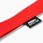 A red lanyard with a black branding tag, made from RPET material.