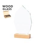 A clear glass plaque with an octagonal shape, mounted on a wooden base, presented in a box.