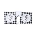 A checkered picnic set featuring white plates, stainless steel cutlery, and a corkscrew on a grey and black placemat.