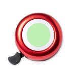 A shiny red bike bell with a silver centre and a black lever for ringing.