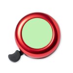 A red bike bell with a black lever and a blank green circular area on top.