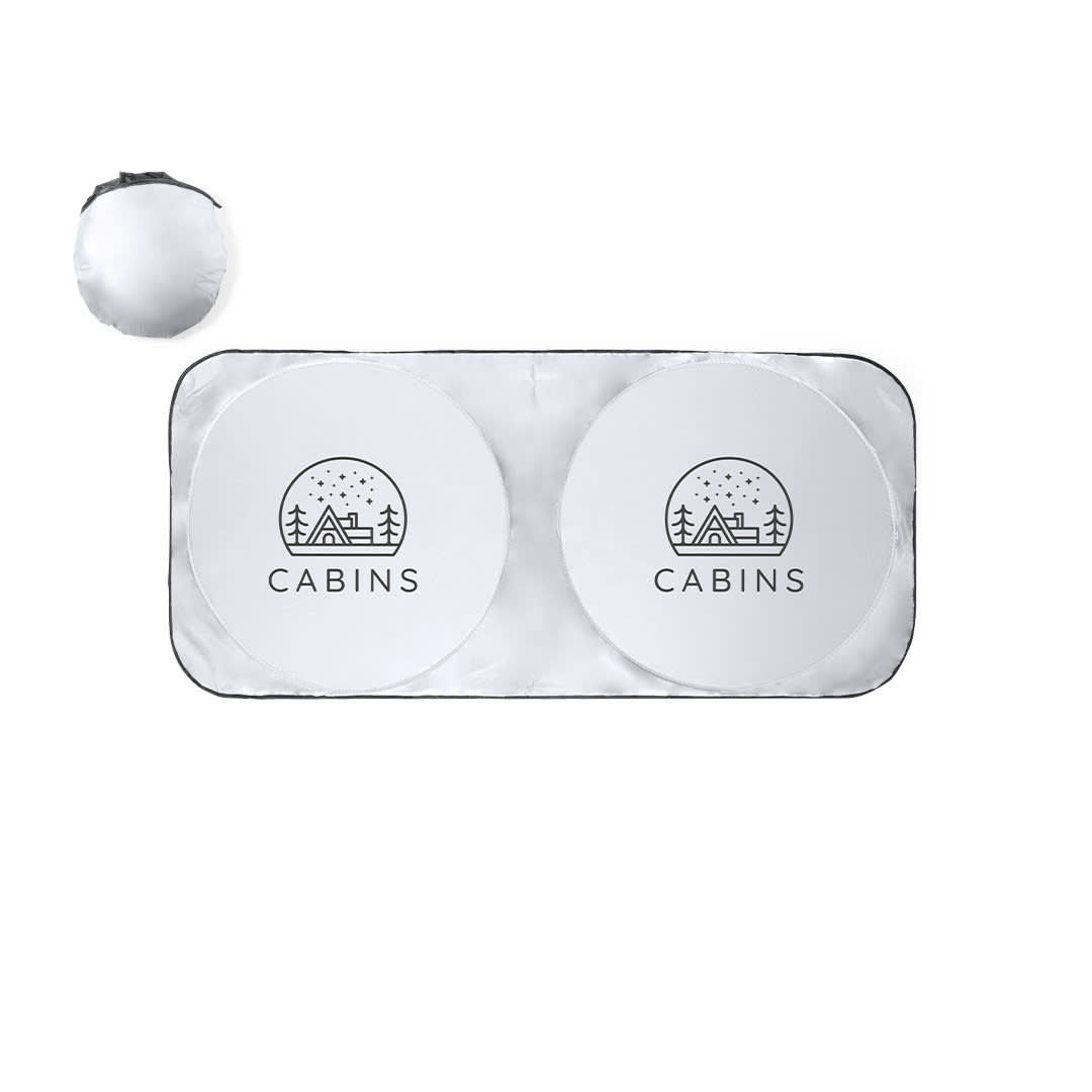 A sunshade featuring a silver finish with two circular sections, each displaying a simple cabin design and logo. A sunshade featuring a silver finish with two circular sections, each displaying a simple cabin design and logo.
