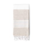 A beige and white towel pareo with striped detailing and tasselled edges, featuring a logo.