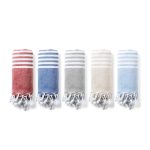 Five rolled towels in red, blue, grey, and beige with striped patterns and tasselled edges.