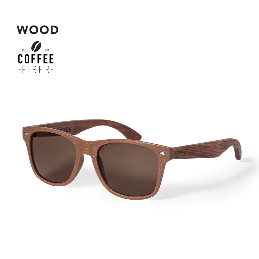 A pair of brown sunglasses made from coffee fibre, featuring wooden arms and a logo on the side. A pair of brown sunglasses made from coffee fibre, featuring wooden arms and a logo on the side.