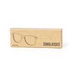 A cardboard box containing Prakay sunglasses featuring a sketch design on the front. The sunglasses appear to be stylish and modern.