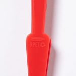 A red hand fan made from recyclable materials, featuring a logo on the handle.