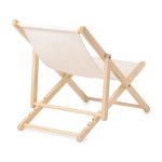 A lightweight folding chair with a natural wooden frame and a cream-coloured fabric seat. It features a minimal design.