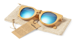 Bamboo sunglasses with blue mirrored lenses, resting on a textured beige pouch with a tag attached.