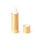 A bamboo tube of Fitol Lip Balm with a white applicator top and a removable cap.