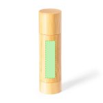 A cylindrical lip balm container in a bamboo finish, featuring a Green label area for branding.