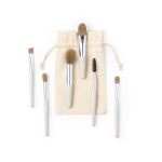 A set of six eyeshadow applicators with soft bristles and a cream pouch for storage.