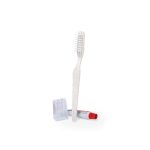 A dental kit set featuring a white toothbrush, white pencil sharpener, and red and white toothpaste tube.