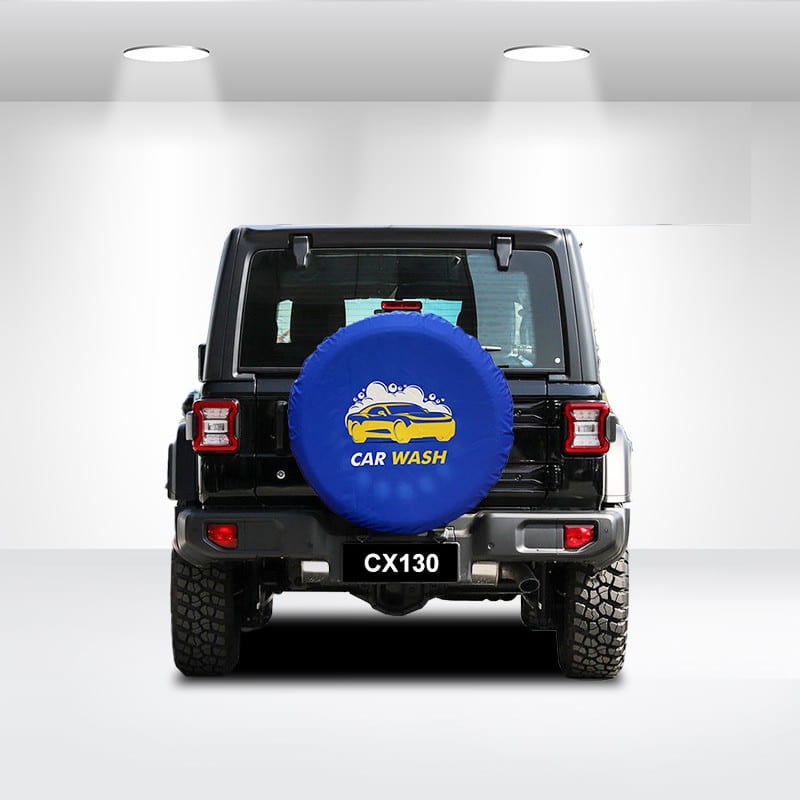 A blue spare tyre cover with a logo is fitted on the back of a black vehicle, featuring a textured surface. Spare Tyre Cover (Dia75cm) - Image 1