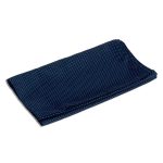 A folded neck scarf in navy blue with a white polka dot pattern, featuring a logo on one side.