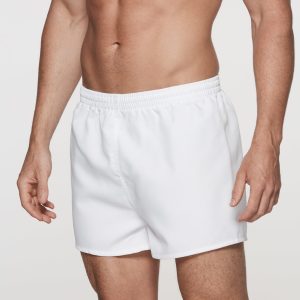 White men's rugby shorts with an elastic waistband, designed for sports activities. Features a logo on the waistband.