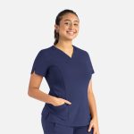 A women's curved V-neck top in navy blue, featuring short sleeves and side pockets. It also has a logo.