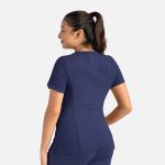 A women's curved V-neck top in navy blue, featuring short sleeves and a fitted design, with branding visible.