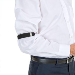 An arm band in black, worn on the upper arm, with a sleek design against a white shirt.