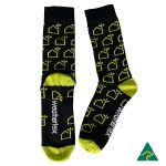 Combed cotton socks in black and lime green featuring a repeated house pattern and a logo.