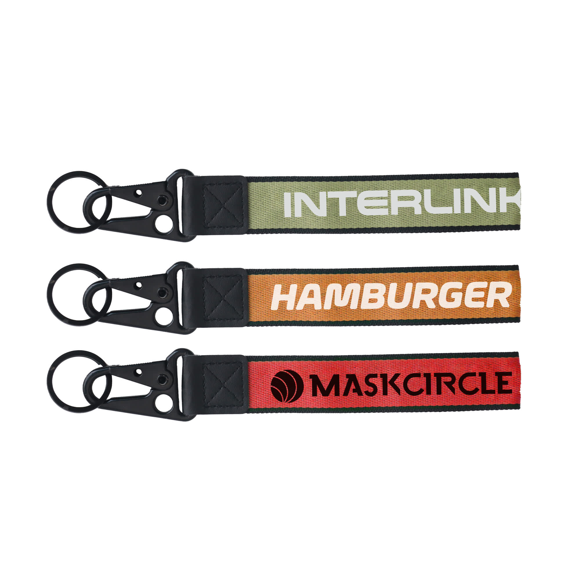 Three keyrings in green, orange, and red, featuring various designs and attached metal clasps. Each has a logo. Jacquard Keyring - Image 1