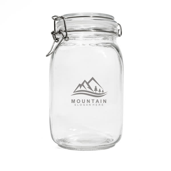 A clear glass mason jar with a metal clamp lid and a logo featuring mountains and trees. A clear glass mason jar with a metal clamp lid and a logo featuring mountains and trees.