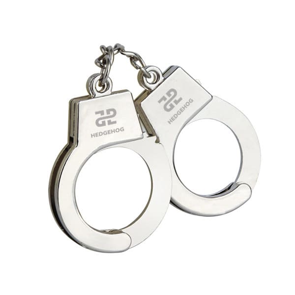 A silver handcuffs keyring holder with a metallic finish and a logo on one side. A silver handcuffs keyring holder with a metallic finish and a logo on one side.