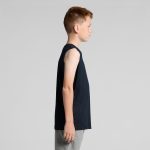 A side view of a young boy wearing a black singlet tank top with grey pants. The tank top features a logo.