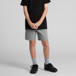 Grey youth stadium shorts with an elastic waistband, styled with a black t-shirt and black sneakers.