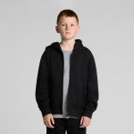 A youth zip hoodie in black, featuring a front zip, hood, and side pockets, styled with a grey t-shirt underneath.