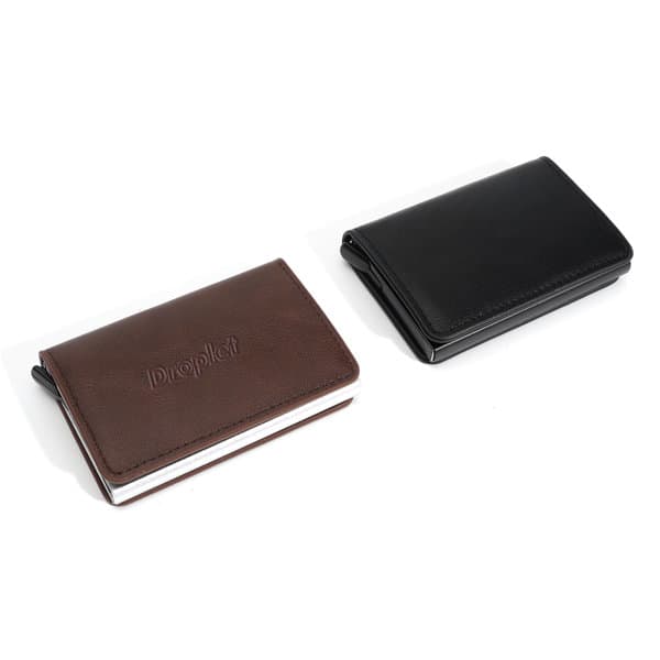Two RFID business card holders in brown and black leather finishes, featuring a subtle logo on the surface. Two RFID business card holders in brown and black leather finishes, featuring a subtle logo on the surface.