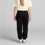 Black youth track pants with a relaxed fit, featuring an elastic waistband and a back pocket.