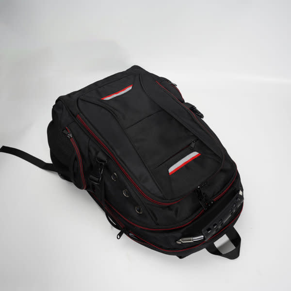 A multifunctional travel laptop backpack in black, featuring red accents and multiple compartments for storage. A multifunctional travel laptop backpack in black, featuring red accents and multiple compartments for storage.